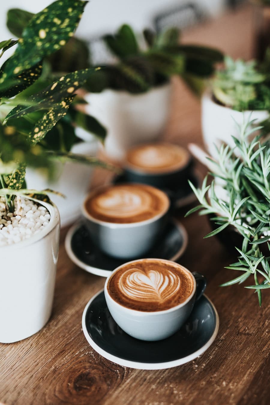 Barista and a fresh coffee on the café counter